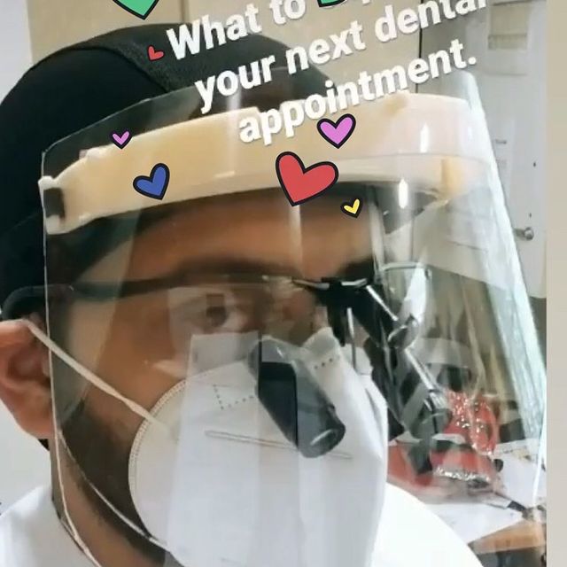 A dentist wearing a face shield while performing treatment at Pure Smiles Marietta, GA